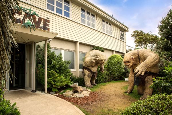 A Large Elephant Standing In Front Of A Building