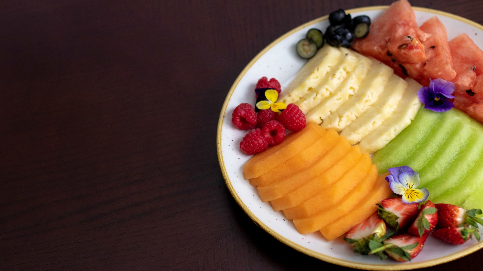 A Bowl Of Fruit On A Plate
